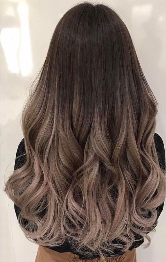 Balayage summer hairstyle with soft blonde highlights at IRIS Hair Salon in Ho Chi Minh City